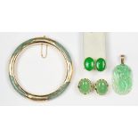 (Lot of 4) Jade and yellow gold jewelry comprised of one pair of earrings featuring (2) oval jadeite