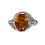 Fire opal, diamond and 14k white gold ring highlighting (1) oval cut fire opal measuring