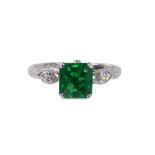 Art Deco emerald, diamond and platinum ring centering (1) emerald-cut emerald weighing approximately