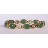 Jadeite and 14k yellow gold bracelet featuring (8) oval jadeite cabochons measuring approximately