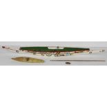 (lot of 2) Native canoes, one Northwest Coast and executed in hide, the other with polychrome