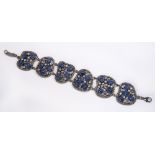 Kyanite, diamond, moonstone and silver bracelet bezel set with (29) oval kyanite cabochons, accented