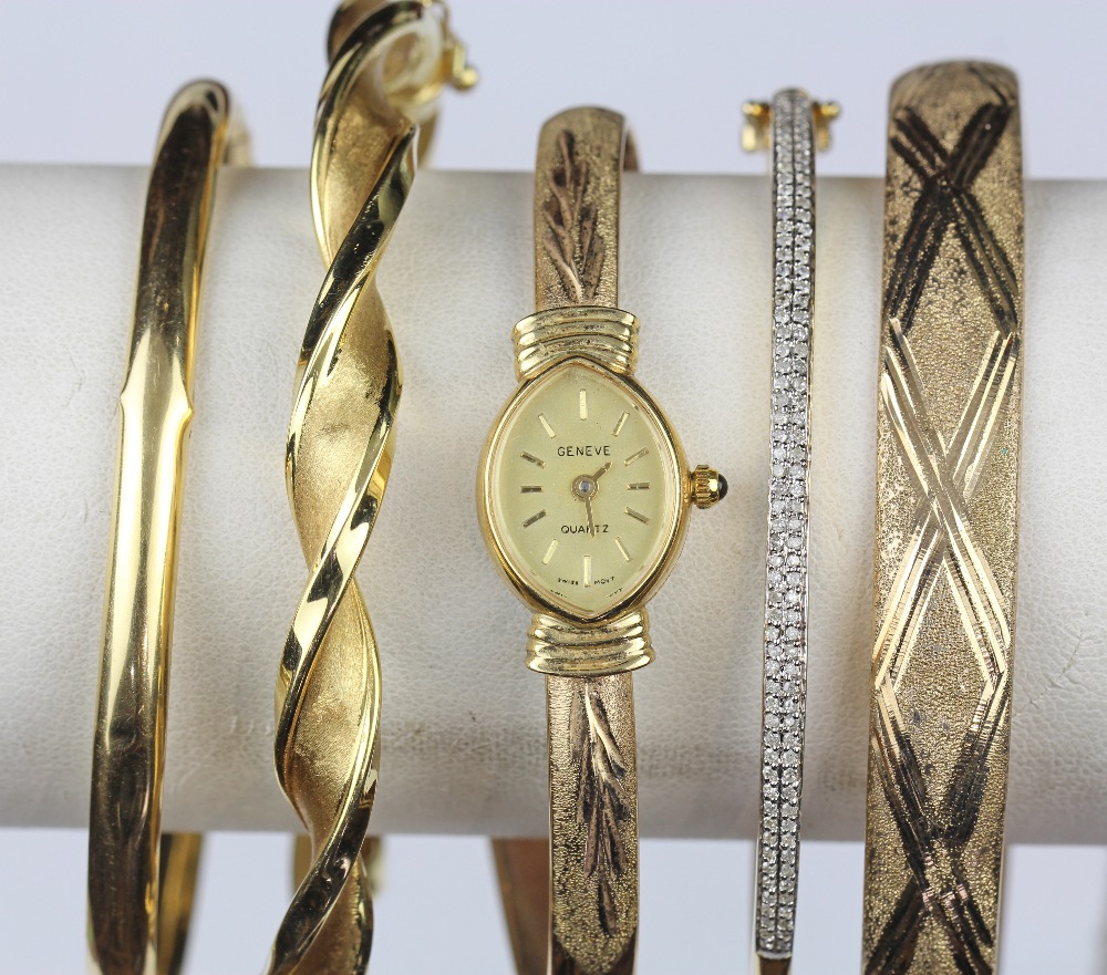 (Lot of 5) Diamond and yellow gold bracelets comprised of one 14k yellow gold hinged bangle,