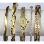 (Lot of 5) Diamond and yellow gold bracelets comprised of one 14k yellow gold hinged bangle,