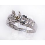 Diamond and 14k white gold semi-mount featuring (4) princess-cut and (4) baguette-cut diamonds