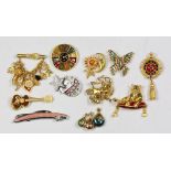 (Lot of 11) Bob Mackie costume jewelry Including one stylized pink cadillac car brooch (4 X 1/2");