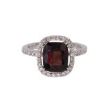 Red spinel, diamond and 18k white gold ring centering (1) cushion shaped red spinel weighing 3.09