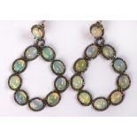 Pair of opal, diamond and sterling silver earrings featuring (20) oval cabochon Welo opals