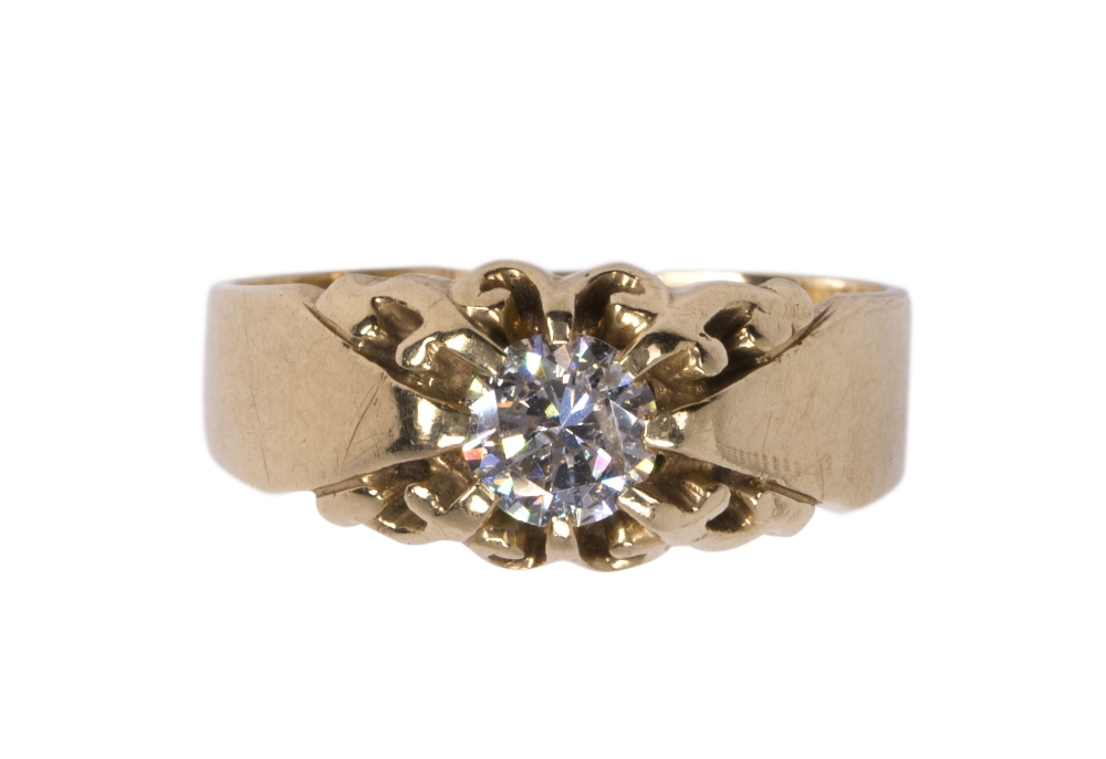 Diamond and 14k yellow gold ring featuring (1) round brilliant cut diamond weighing approximately