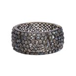 Labradorite, diamond and silver bangle bracelet composed of numerous rose cut labradorites, accented