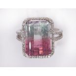 Bicolor tourmaline and diamond ring featuring (1) cut corner rectangular step cut tourmaline in