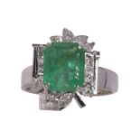 Emerald, diamond, and 18k white gold ring centering (1) emerald-cut emerald weighing approximately