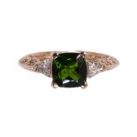 Diopside, diamond and 14k rose gold ring featuring a cushion cut green diopside weighing