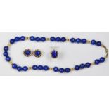 (Lot of 3) Lapis lazuli, 14k yellow gold and metal jewelry comprised of one necklace having (31),