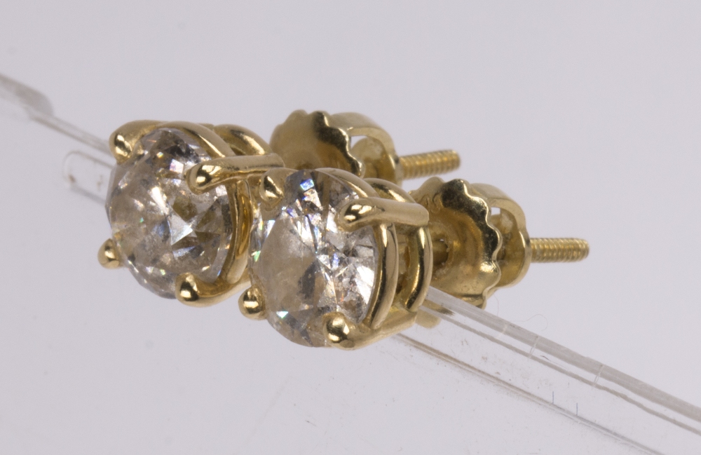 Pair of diamond and 18k yellow gold ear studs featuring (2) round brilliant cut diamonds weighing in - Image 2 of 3