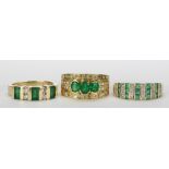 (Lot of 3) Emerald, diamond and yellow gold rings including one ring featuring (3) oval cut emeralds