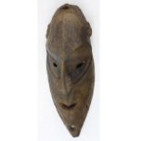 Papua, New Guinea old and much used heavy, thick carved wood mask, heavily patinated on back,
