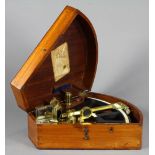G.W. Peter and Zoon Dutch brass and ebony octant in a walnut case, 5"h x 13.75"w x 12"d. Provenance: