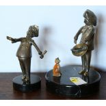 (Lot of 2) Silvered bronze and enamel figural group, each depicting a chef preparing food, rising on