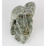 Ethnographic moss agate carved stone figural bust, having two stylized faces, 6"h x 10"w x 6"d