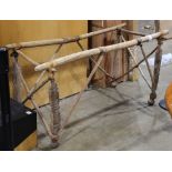 Northern Africa wood and camel hide travel rack, 32"h x 62"w x 30"d; Provenance: The collection of