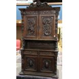 Continental Renaissance style oak buffet a deux corps, the superstructure relief carved panels