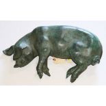 Patinated bronze figural statue of a piglet in repose, 5"h x 21"w x 13"d