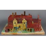 Scale model of an English manor house, 20th Century, executed in plaster and wood, the polychrome