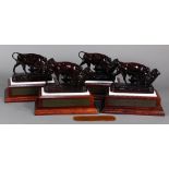 (Lot of 4) Metal enamel figural group, each depicting a bull and bear fighting, after the original