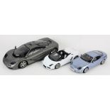 (lot of 3) Die cast model car group, consisting of a 1 / 12 scale McLaren with hinged doors,