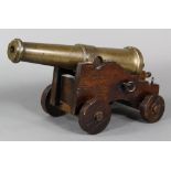 Italian bronze hand cannon mounted on an oak carriage, 18th century, having a patinated bronze