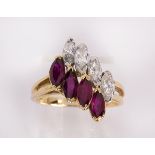 Ruby, diamond and 18k yellow gold ring featuring )4) marquise-cut diamonds, weighing a total of