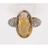 Citrine, diamond, 18k yellow and white gold ring featuring an oval checkerboard cut citrine,