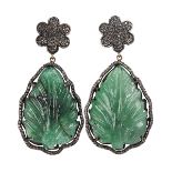 Pair of carved emerald, diamond and silver ear pendants featuring (2) carved emerald leafs,