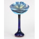 Tiffany style jack in the pulpit style vase, executed in iridescent green and purple, having an