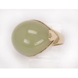 Agate and 14k yellow gold ring featuring (1) curved oval agate cabochon, measuring approximately