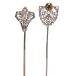 (Lot of 2) Diamond and 14k gold stick pins comprised of (1) old European-cut brown diamond, weighing