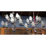 Pair of Continental silver plated chandeliers, each having ten lights with scrolled arms, larger: