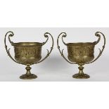 Pair of Classical style patinated bronze urns, each having handled sides, centering a freize of