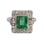 Emerald, diamond and 18k white gold ring centering one rectangular-cut emerald, weighing