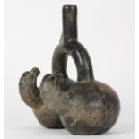 Pre-Columbian Chimu blackware stirrup spout vessel, 100-200 AD., having two chambers, the form