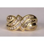 Diamond and 14k yellow gold ring featuring (10) full and (28) baguette-cut diamonds, weighing a
