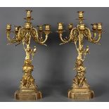 Pair of Renaissance style gilt bronze candelabra, having six lights continuing to scroll form