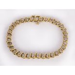 Diamond and 14k yellow gold bracelet featuring (34) full-cut diamonds, weighing a total of