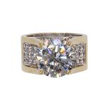 Diamond and 18k two tone ring centering (1) round brilliant-cut diamond, weighing approximately 6.30