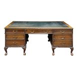 Chippendale style mahogany partner's desk circa 1870, having an embossed leather writing surface,