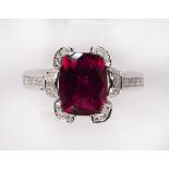 Rubellite, diamond and 14k white gold ring centering one faceted top, cushion shape pinkish-red