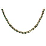 Emerald, diamond and 14k yellow gold necklace featuring (59) emerald-cut emeralds, weighing a