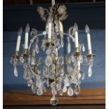 French Baccarat style crystal chandelier, having eight lights, with crystal drops and suspended from