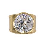 Diamond and 18k yellow gold ring featuring (1) round brilliant-cut diamond, weighing approximately